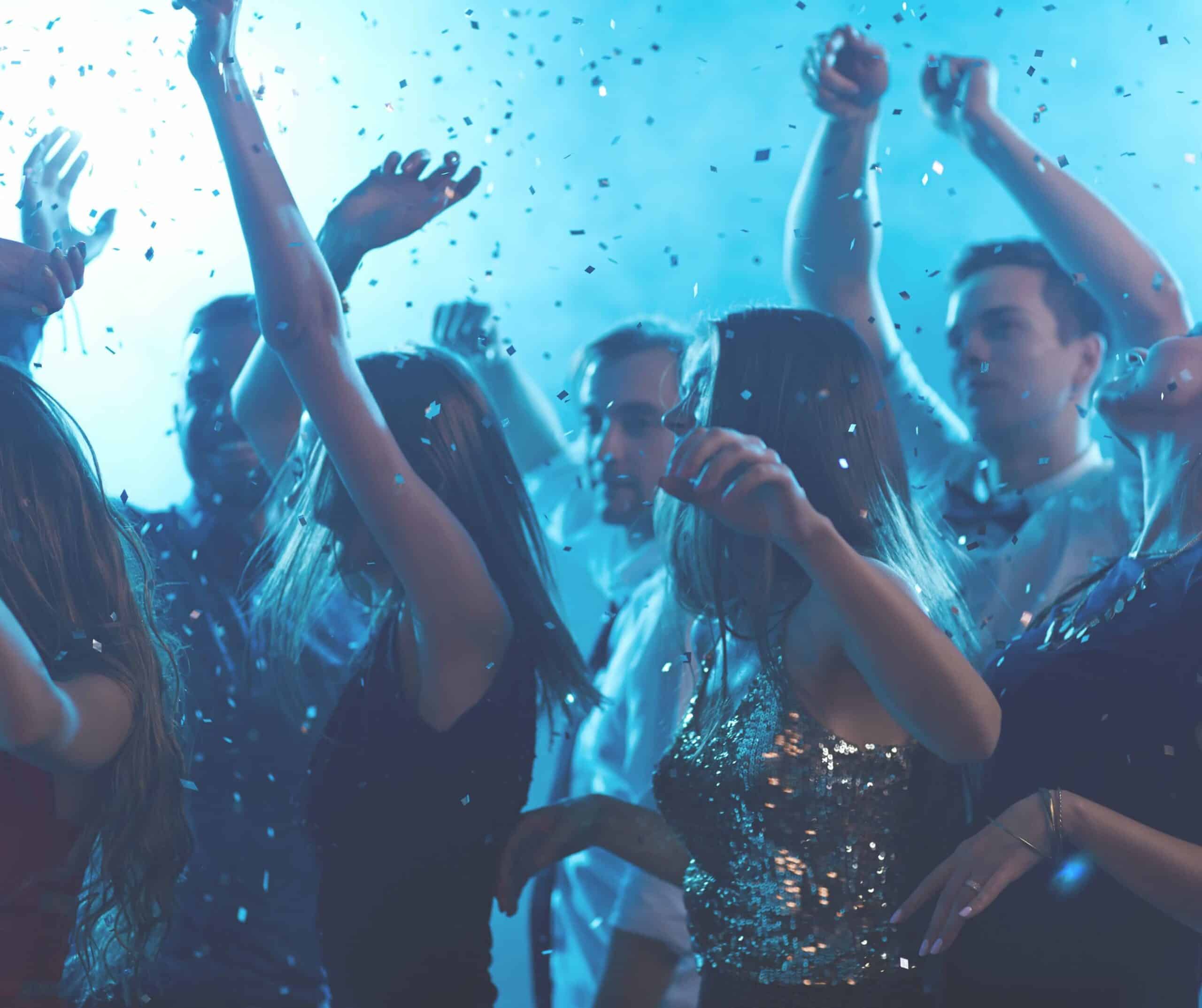 a group of friends dancing at a club