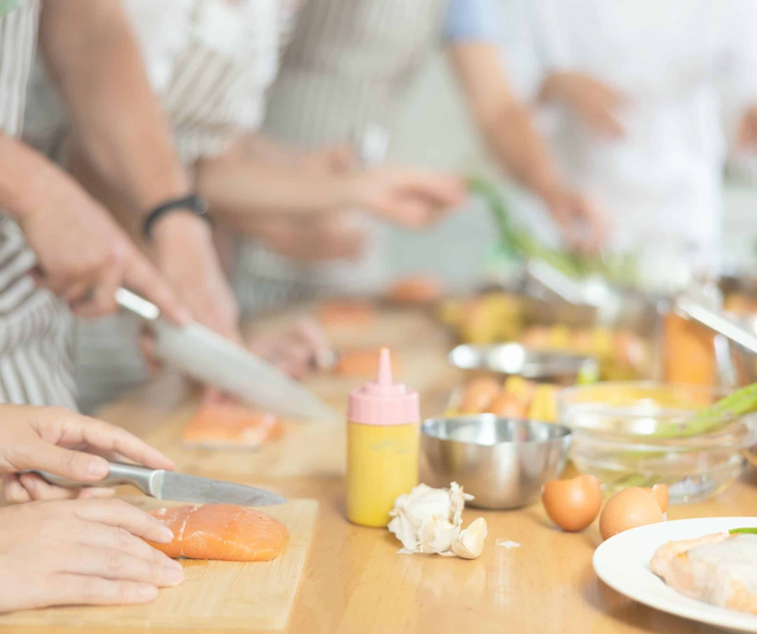 a cooking class cutting salmon